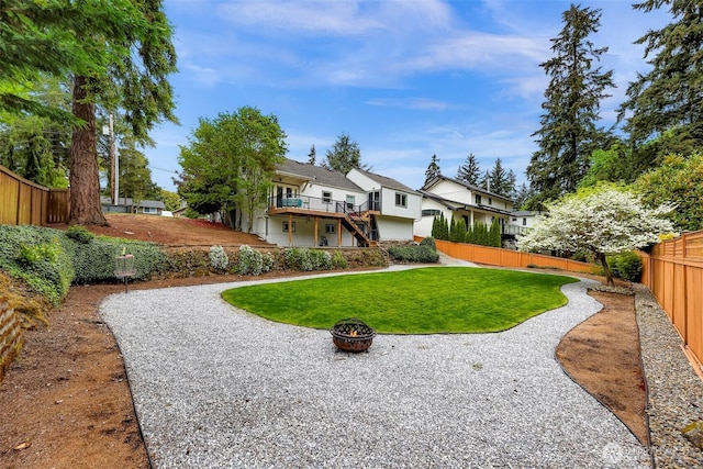 1626 106th Ave SE, Bellevue, WA 98004 - exterior space featuring stairs, a residential view, a wooden deck, a fire pit, and a fenced backyard