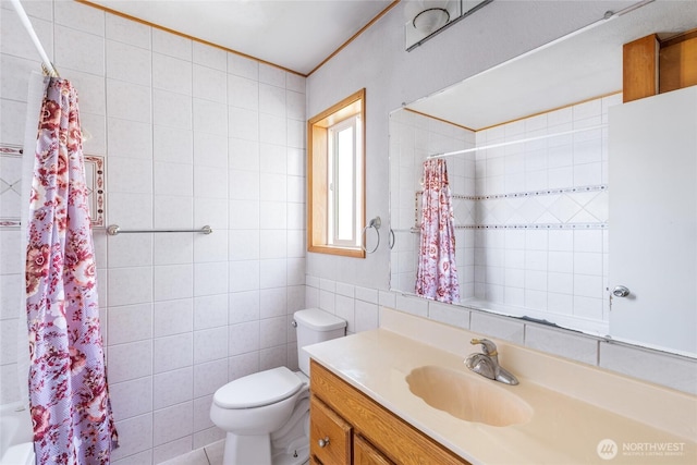 full bathroom with vanity, shower / bathtub combination with curtain, toilet, and tile walls