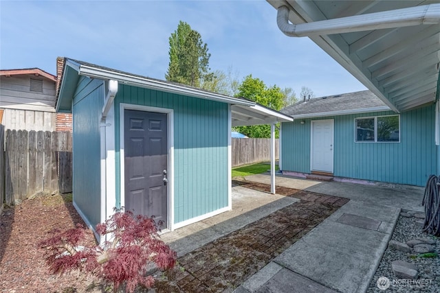 view of shed with a fenced backyard