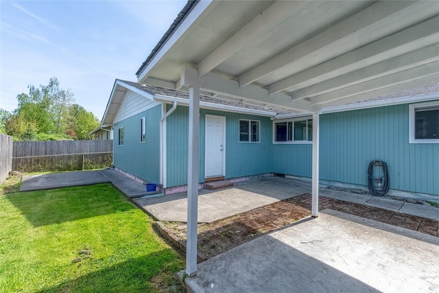exterior space with a patio, a fenced backyard, and a yard