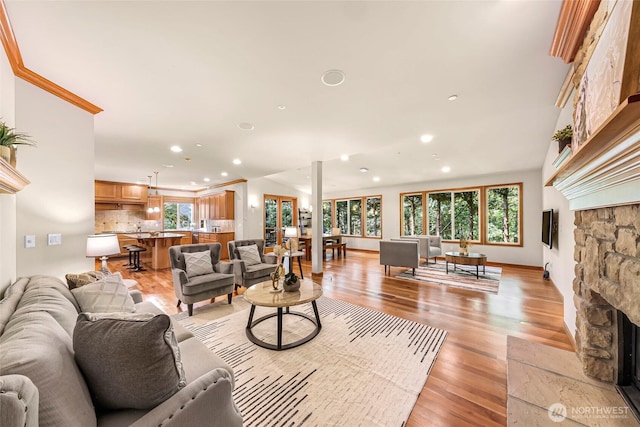 living area with plenty of natural light, recessed lighting, and a fireplace