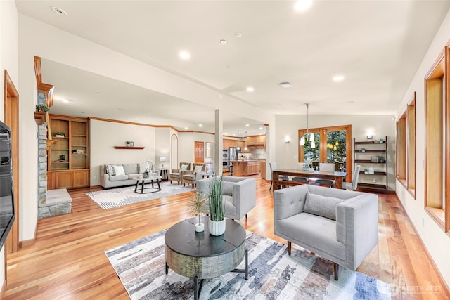 living room featuring recessed lighting and light wood-style flooring