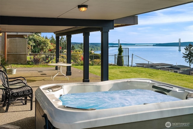 6614 N 49th St, Tacoma, WA 98407 - view of patio with a water view, a hot tub, and fence