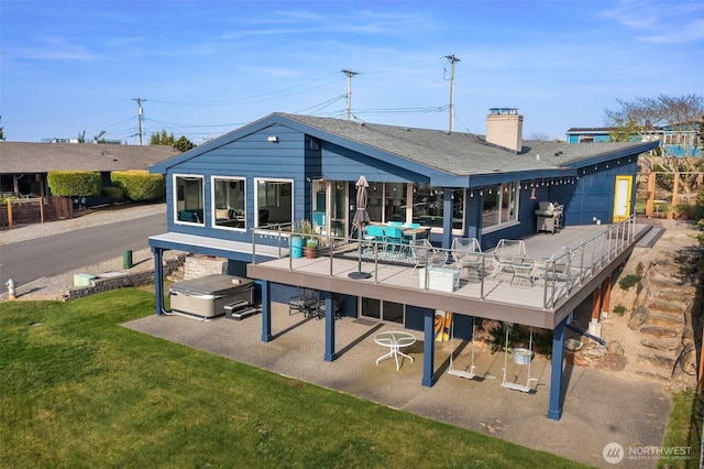 6614 N 49th St, Tacoma, WA 98407 - rear view of property featuring a hot tub, a wooden deck, a chimney, a patio, and a yard