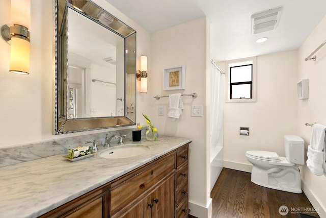 514 30th Ave E, Seattle, WA 98112 - bathroom featuring visible vents, vanity, wood finished floors, toilet, and baseboards