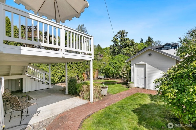 514 30th Ave E, Seattle, WA 98112 - view of yard featuring a wooden deck, a patio area, and stairway