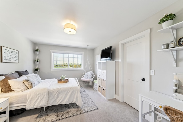 bedroom with light colored carpet