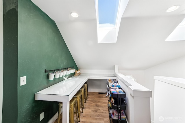additional living space with recessed lighting, vaulted ceiling, and wood finished floors
