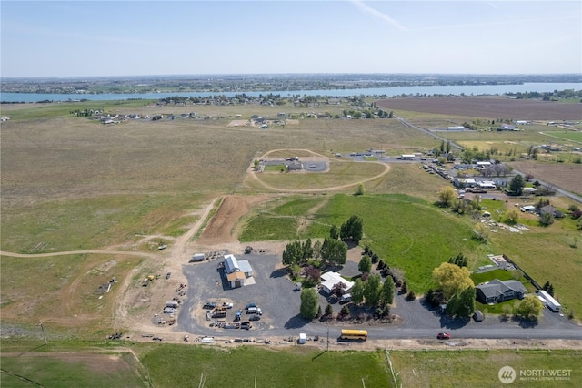aerial view with a rural view and a water view