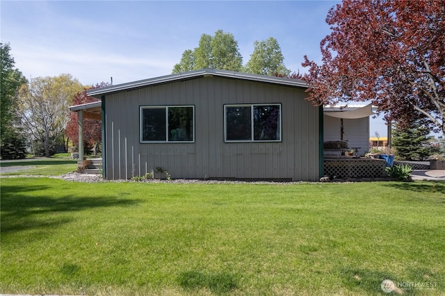 view of home's exterior with a yard