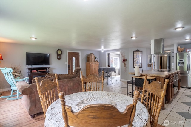 dining room featuring light tile patterned floors, recessed lighting, and baseboards
