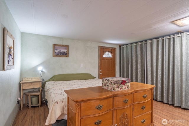 bedroom featuring light wood-style floors