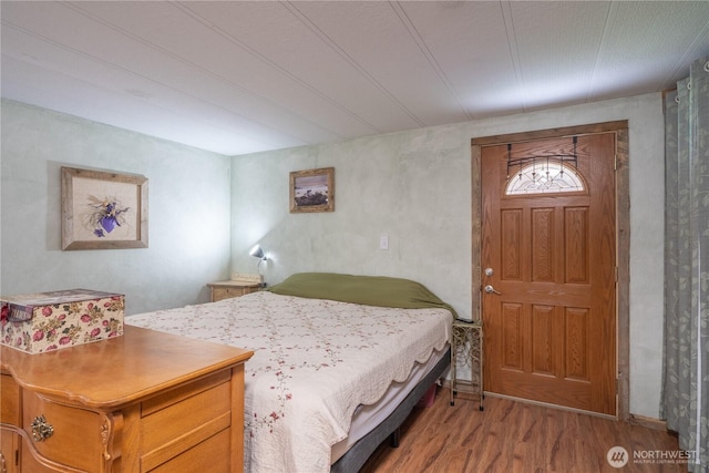 bedroom with wood finished floors