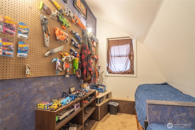 bedroom with lofted ceiling, carpet, and baseboards