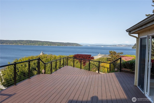 wooden deck with a water view
