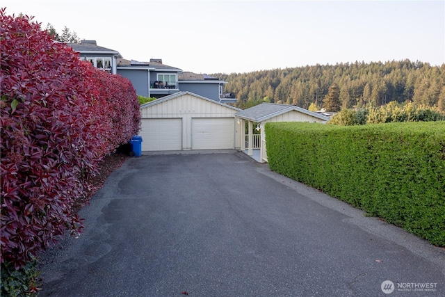 exterior space with a wooded view