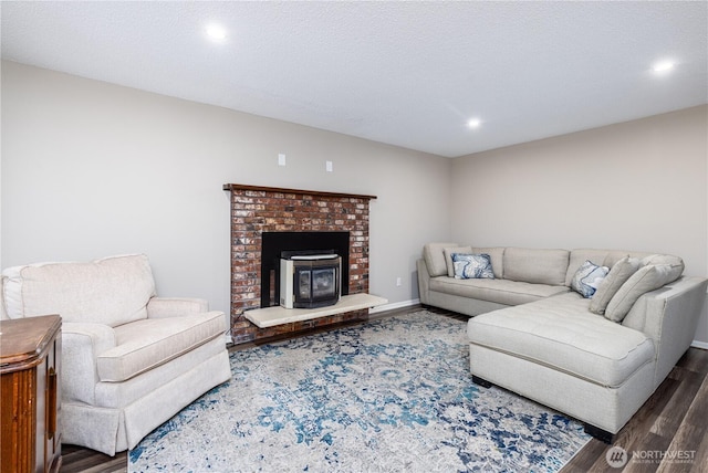 living area featuring wood finished floors, recessed lighting, and baseboards