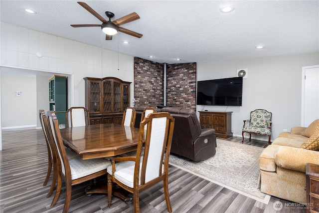 dining space featuring recessed lighting, a textured ceiling, ceiling fan, and wood finished floors