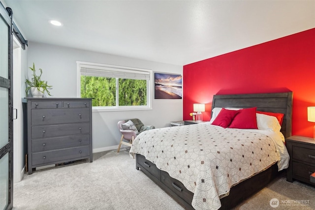 carpeted bedroom featuring recessed lighting, baseboards, and a barn door