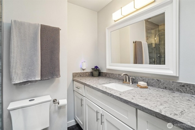 full bath with an enclosed shower, toilet, and vanity