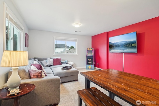 living room featuring carpet floors, baseboards, and visible vents