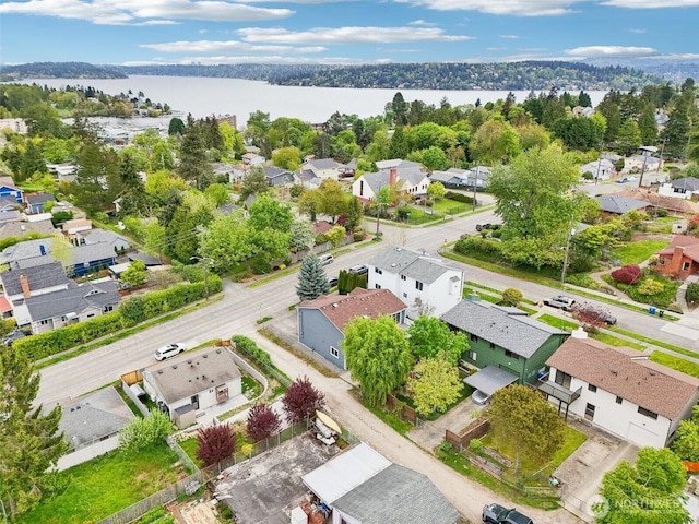 drone / aerial view featuring a water view and a residential view