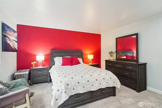 bedroom featuring baseboards and carpet