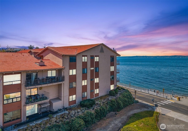 view of building exterior with a water view