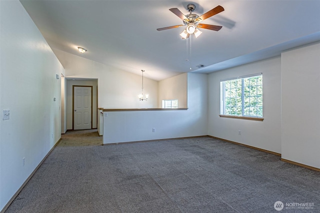 8342 49th Loop SE, Olympia, WA 98513 - empty room with carpet flooring, ceiling fan with notable chandelier, visible vents, baseboards, and vaulted ceiling
