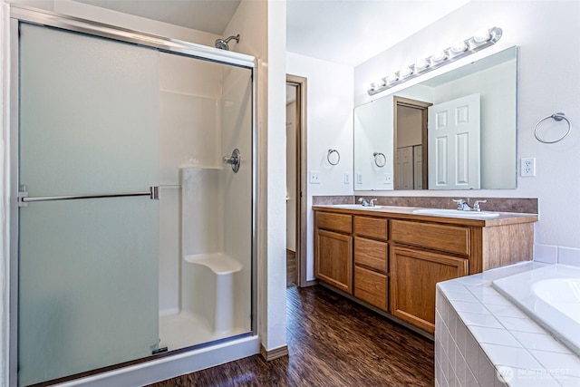 8342 49th Loop SE, Olympia, WA 98513 - full bath with a sink, wood finished floors, a shower stall, double vanity, and a bath