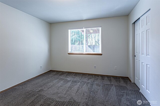 8342 49th Loop SE, Olympia, WA 98513 - unfurnished bedroom with carpet flooring, a closet, and baseboards