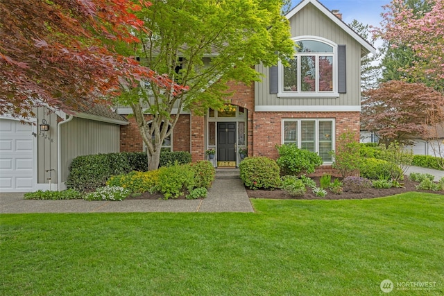 traditional-style house with brick siding and a front yard
