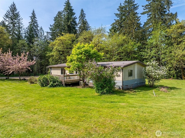 view of yard featuring a deck
