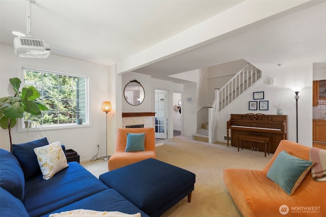 4375 Erin St, Port Townsend, WA 98368 - living room with stairway, light carpet, and a fireplace