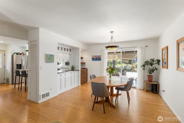 4375 Erin St, Port Townsend, WA 98368 - dining area featuring light wood-style flooring and baseboards
