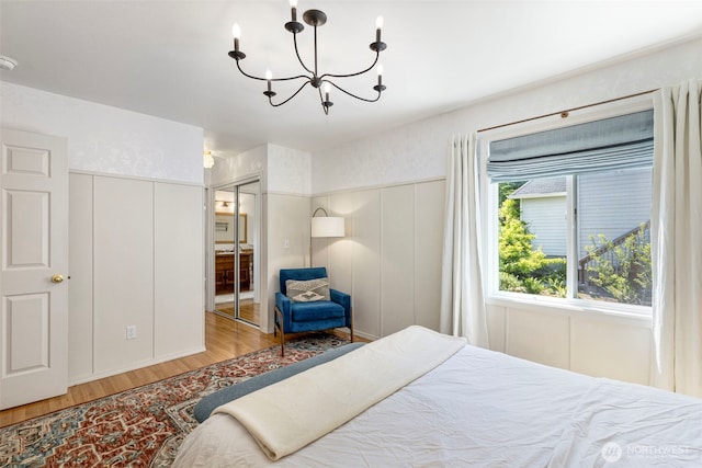 4375 Erin St, Port Townsend, WA 98368 - bedroom featuring wood finished floors and a chandelier