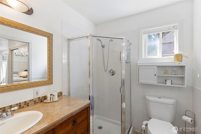 4375 Erin St, Port Townsend, WA 98368 - bathroom with vanity, toilet, a shower stall, tile walls, and a chandelier
