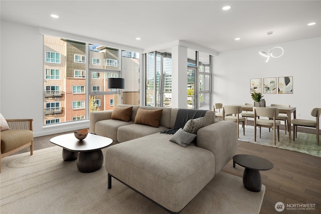 living room featuring recessed lighting and wood finished floors