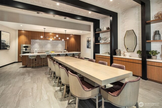 dining room featuring baseboards, recessed lighting, and visible vents