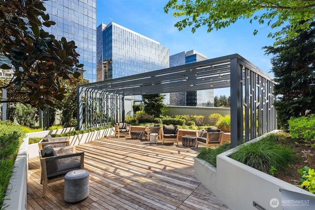 wooden deck featuring central air condition unit, a pergola, and an outdoor living space