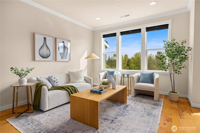 living area with light wood-style floors, crown molding, baseboards, and recessed lighting