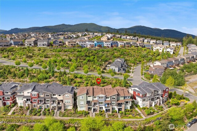 aerial view of residential area with a mountainous background
