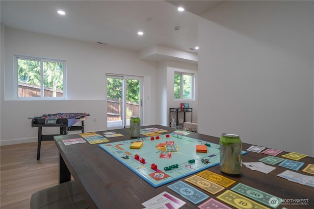 rec room with recessed lighting and light wood-style floors