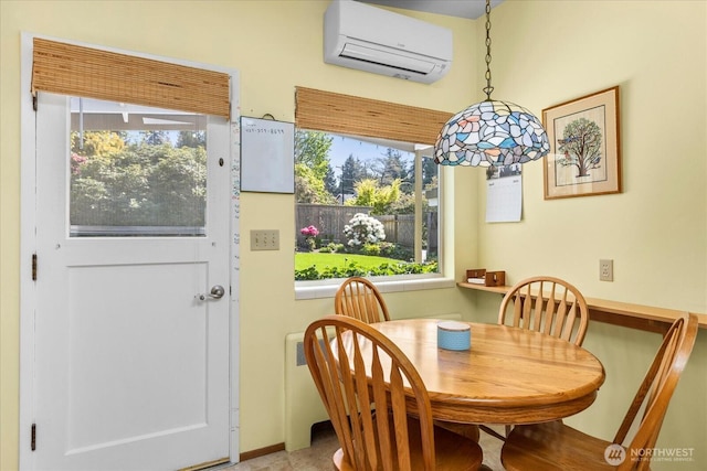 dining area featuring a wall mounted AC