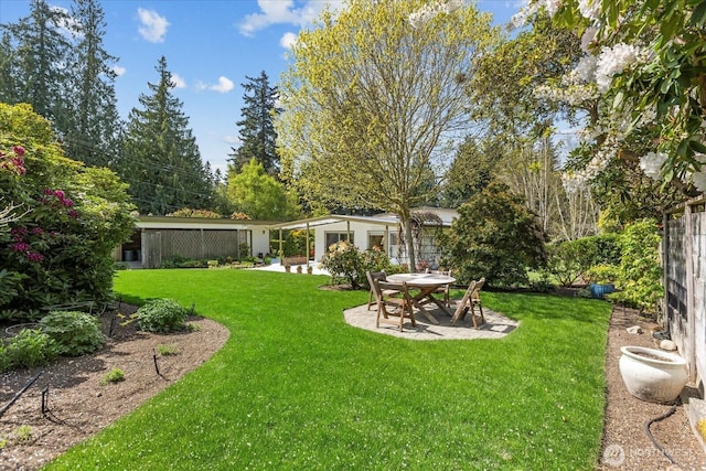view of yard with a patio and fence