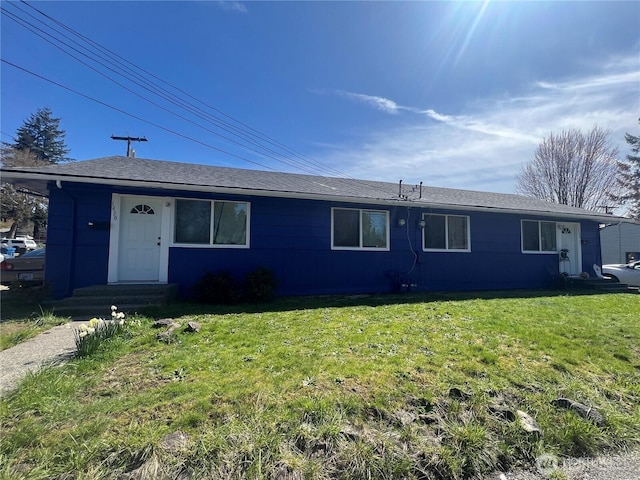 single story home with a front lawn