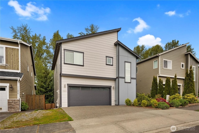 11508 SE 83rd St, Newcastle, WA 98056 - contemporary house with concrete driveway, an attached garage, and fence