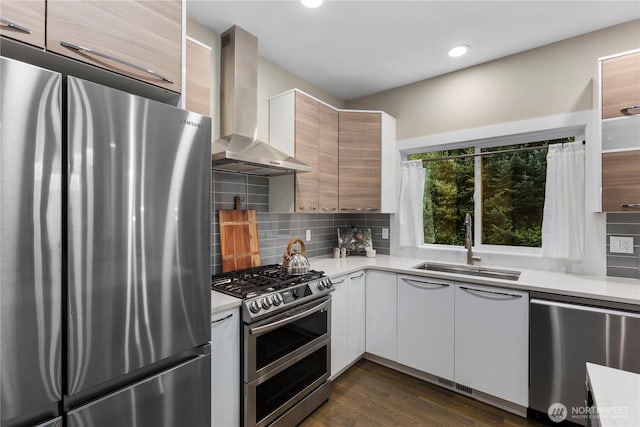 11508 SE 83rd St, Newcastle, WA 98056 - kitchen with modern cabinets, a sink, wall chimney range hood, light countertops, and appliances with stainless steel finishes