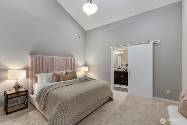 11508 SE 83rd St, Newcastle, WA 98056 - carpeted bedroom featuring baseboards, a barn door, connected bathroom, and high vaulted ceiling
