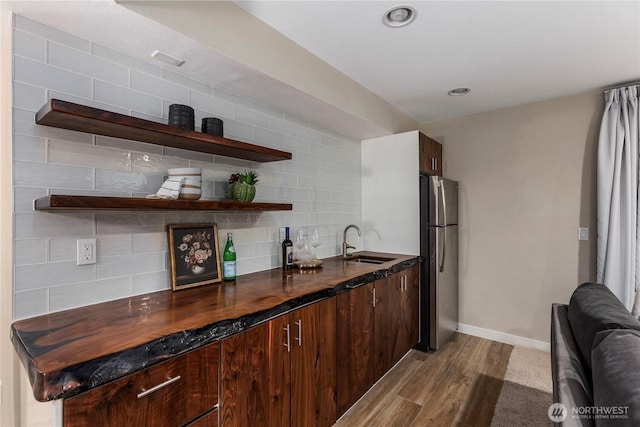 11508 SE 83rd St, Newcastle, WA 98056 - kitchen featuring a sink, freestanding refrigerator, open shelves, light wood finished floors, and dark countertops